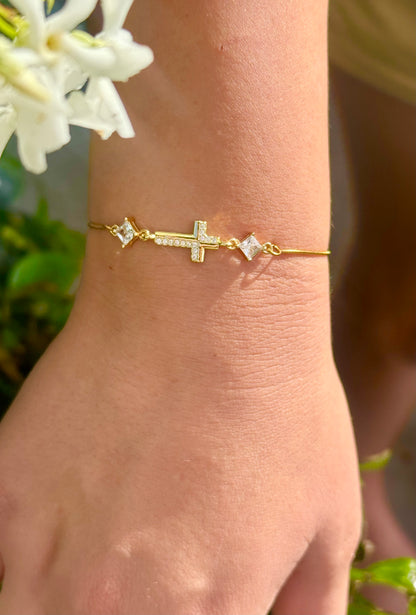Cubic Zirconia Crystal Gold Plated Cross Bracelet paired with a 14KT Gold Snake Bolo Chain Made in The USA