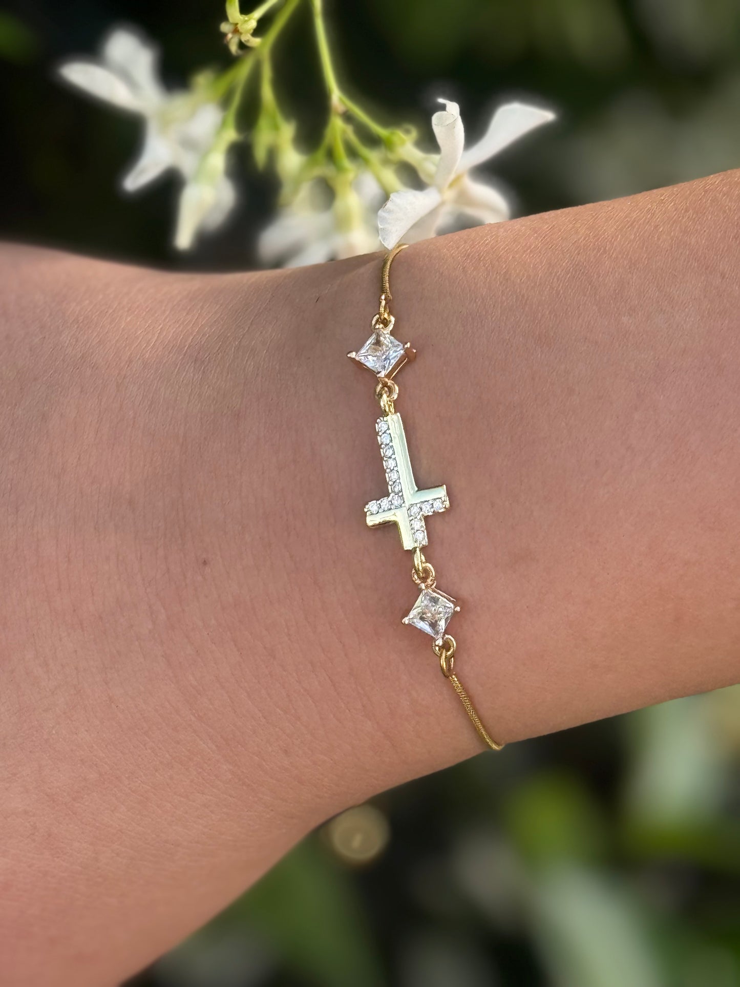 Cubic Zirconia Crystal Gold Plated Cross Bracelet paired with a 14KT Gold Snake Bolo Chain Made in The USA