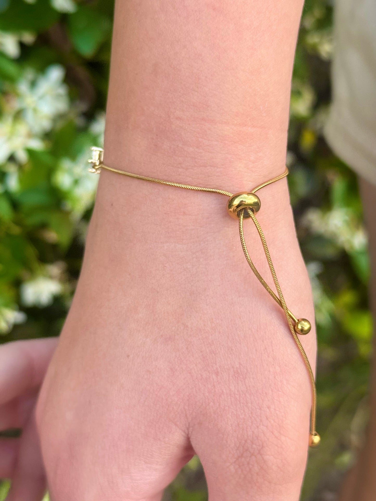 Cubic Zirconia Crystal Gold Plated Cross Bracelet paired with a 14KT Gold Snake Bolo Chain Made in The USA